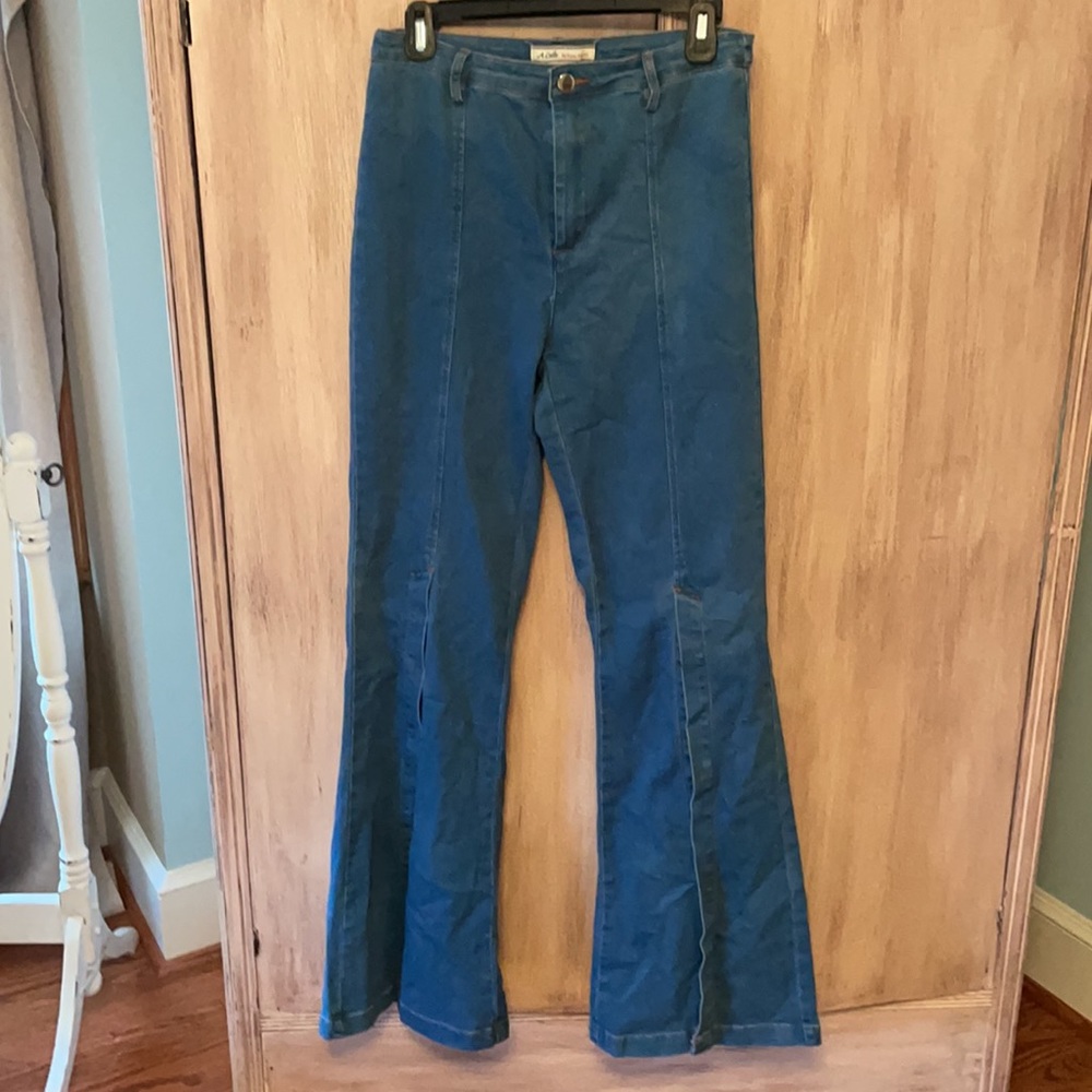 Flare jeans with mid knee slit
